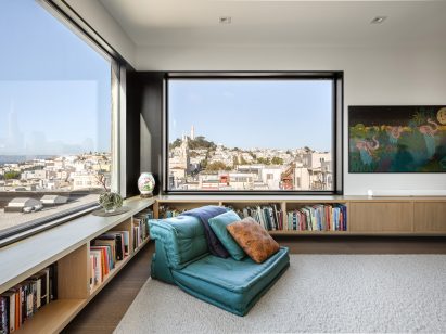 Living room with a lounge chair at a corner window