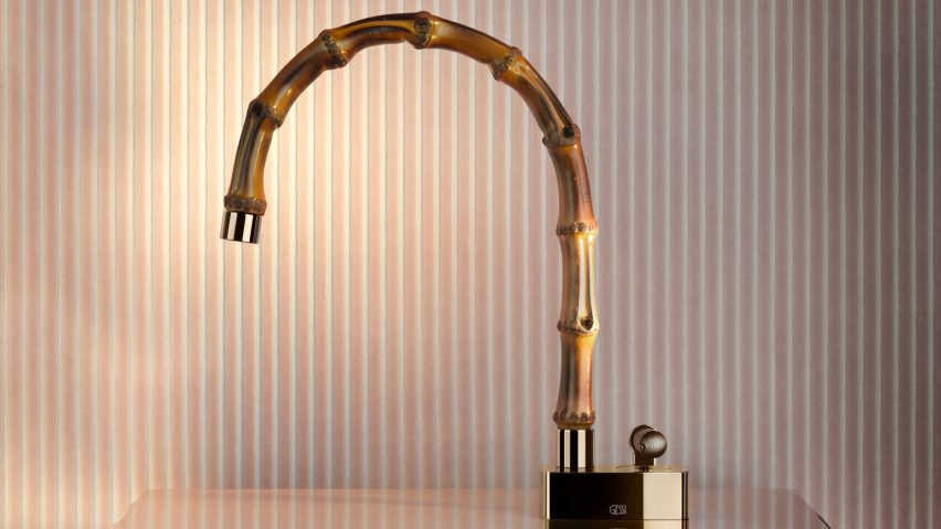 Curved tap made from bamboo on dusky pink background