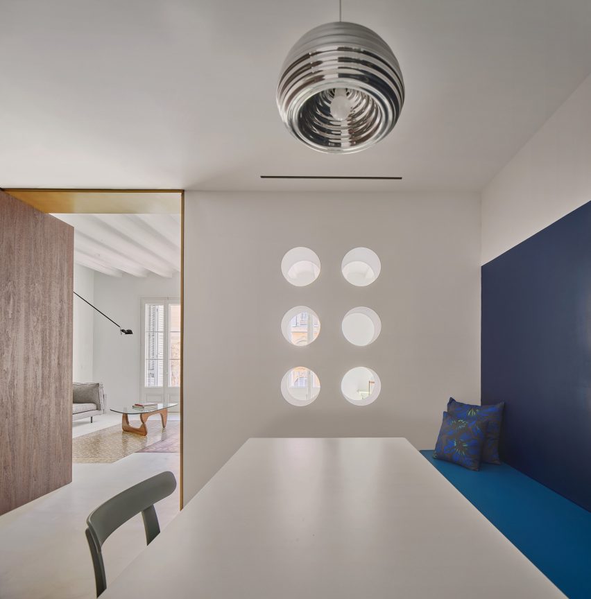 Dining room interior of Girona Street apartment in Barcelona, designed by Raúl Sanchez Architects