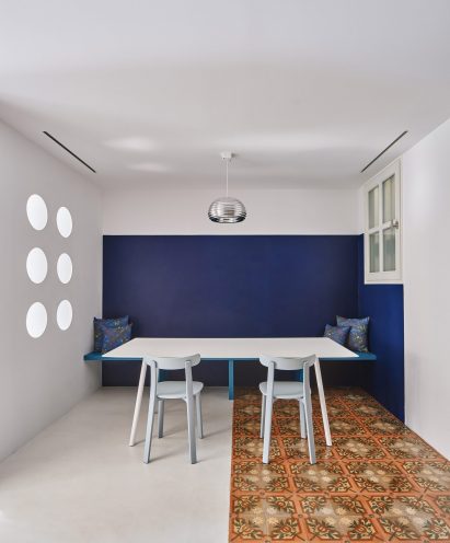 Dining room interior of Girona Street apartment in Barcelona, designed by Raúl Sanchez Architects