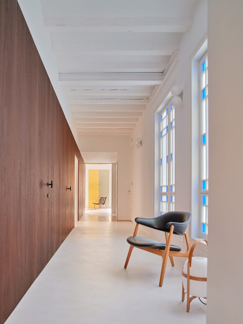 Girona Street apartment designed by Raúl Sanchez Architects features walnut wood wall