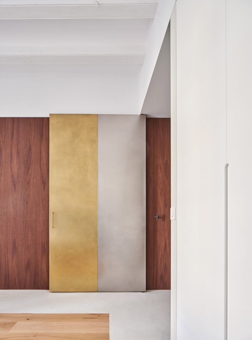 Girona Street apartment designed by Raúl Sanchez Architects features brass and steel door