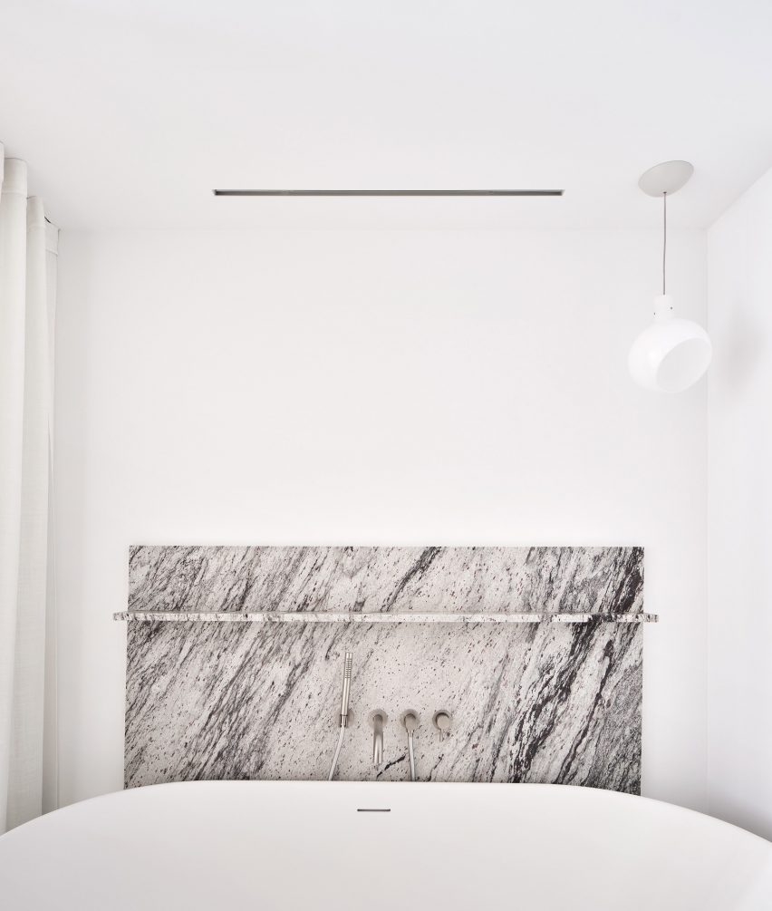 Bathroom interior of Girona Street apartment in Barcelona, designed by Raúl Sanchez Architects