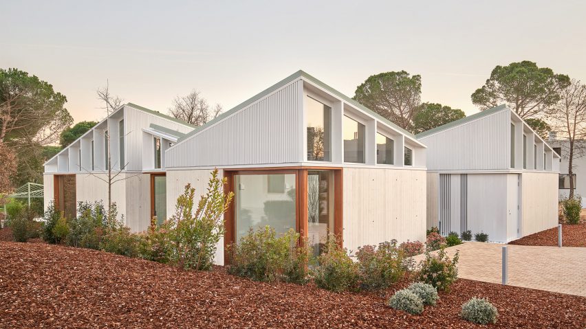 A cluster of mono-pitched square structures comprising House 016 by Arquitecturia