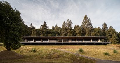 Rectilinear clubhouse with a cantilevered terrace by Studio RC