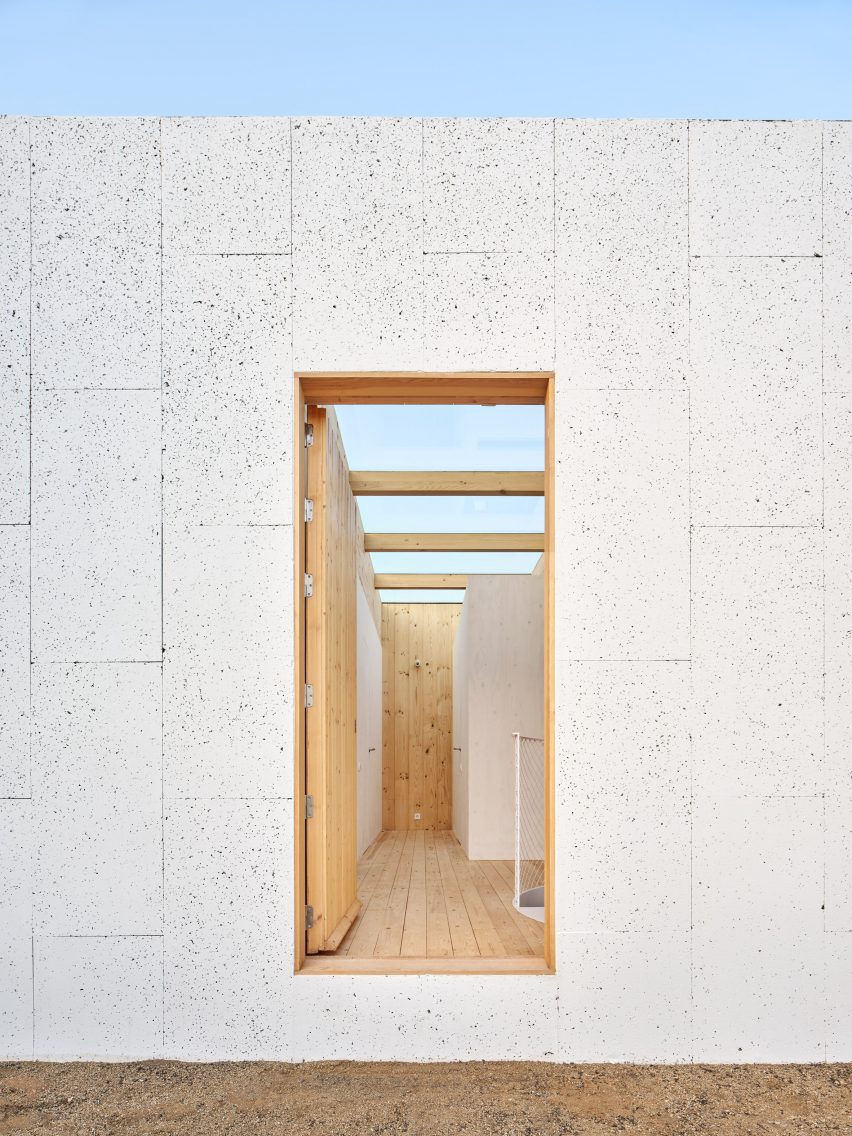 Exterior of House on a Brick Base by Agora Arquitectura