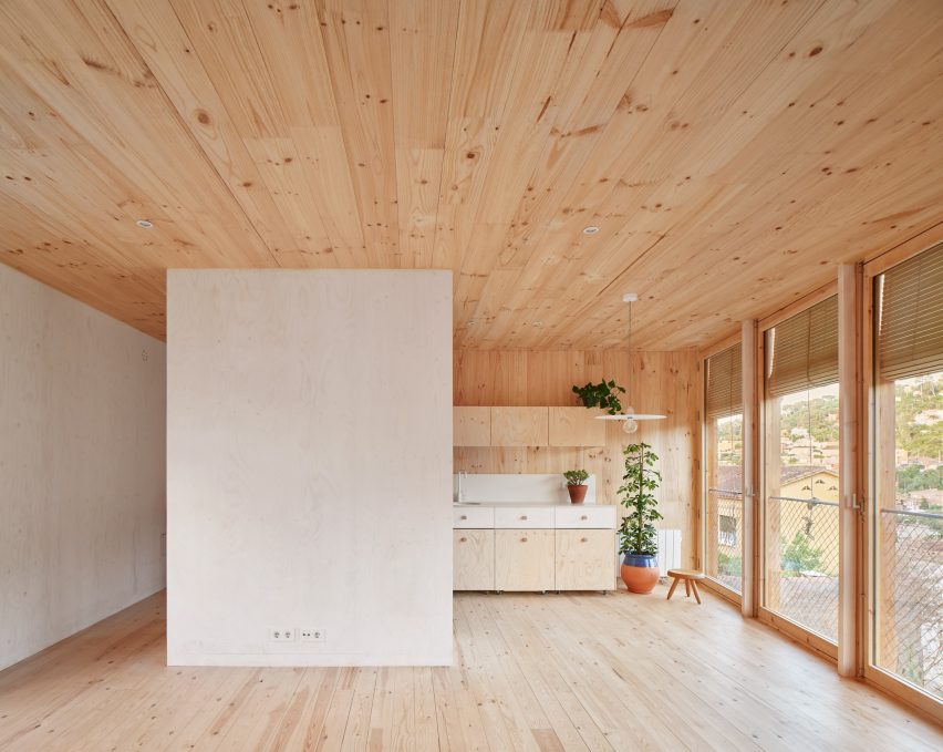 Interior of House on a Brick Base by Agora Arquitectura