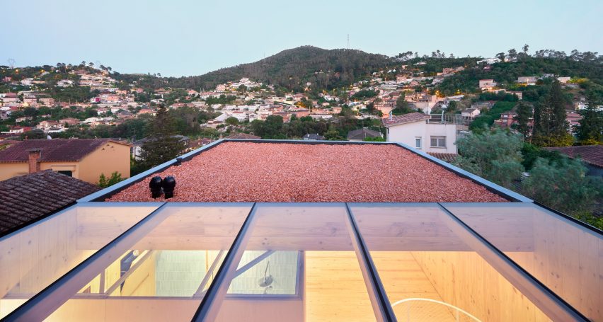 Exterior of House on a Brick Base by Agora Arquitectura