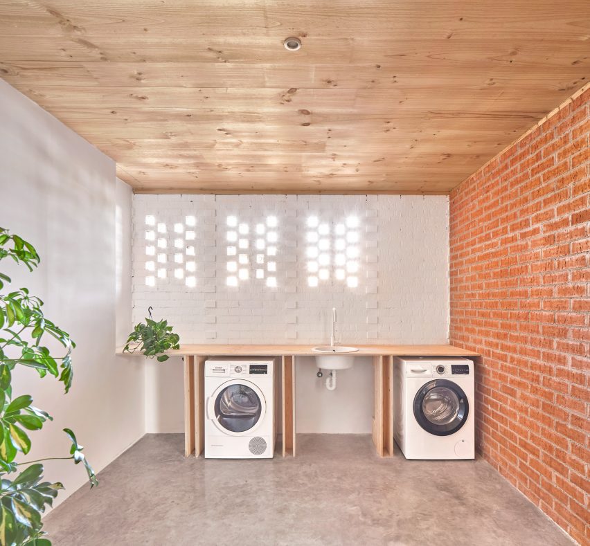 Interior of House on a Brick Base by Agora Arquitectura