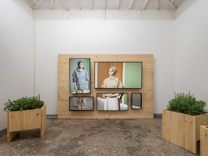 Screens showing a documentary film at the Finnish Pavilion