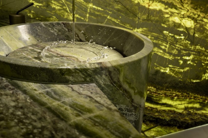 Irish Green marble by Antolini used on bathroom walls, sink and vanity unit