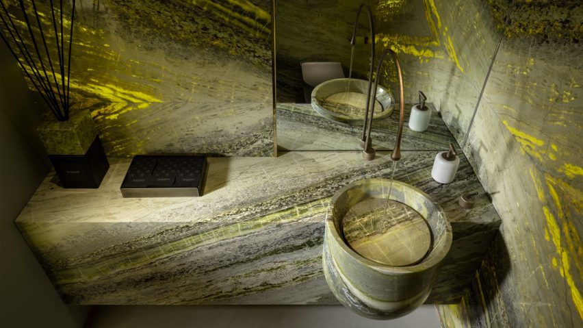 Irish Green marble by Antolini used on bathroom walls, sink and vanity unit