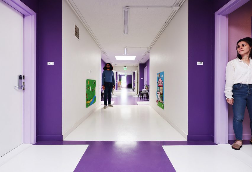 White and purple corridor at The Alvarado by Kadre Architects