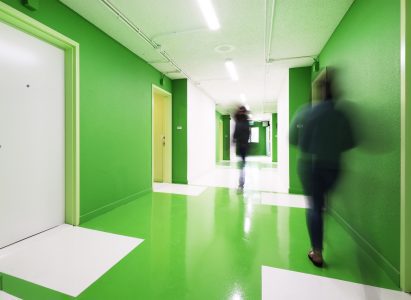 Interior corridor with green and white glossy walls