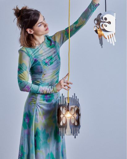 Kiki Goti with her OO+II pendants