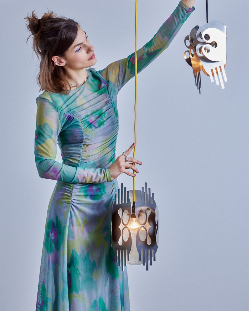 Kiki Goti with her OO+II pendants
