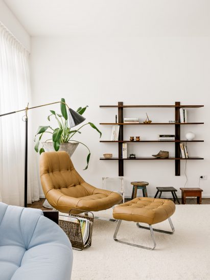 Living room with caramel-coloured armchair and ottoman