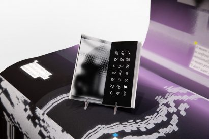 Open book containing white symbols on a black background