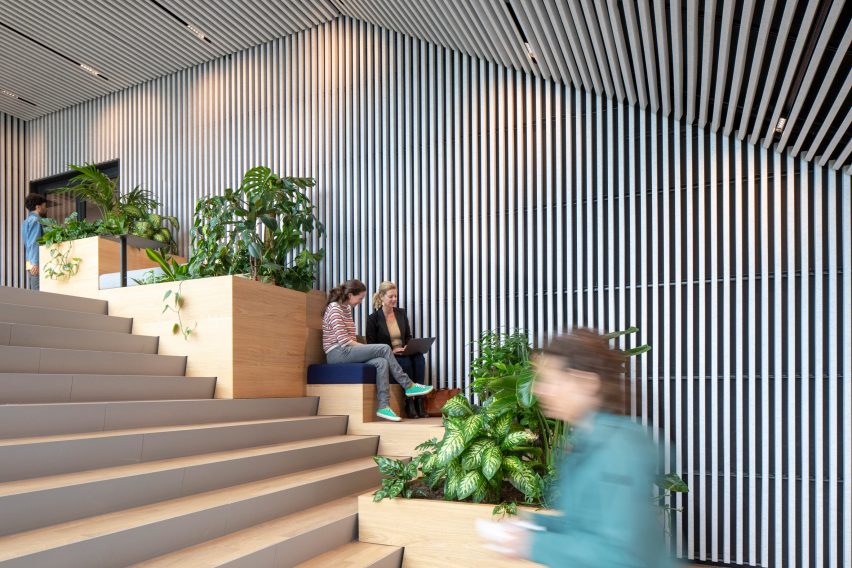 Wooden staircase with built-in seating and plants