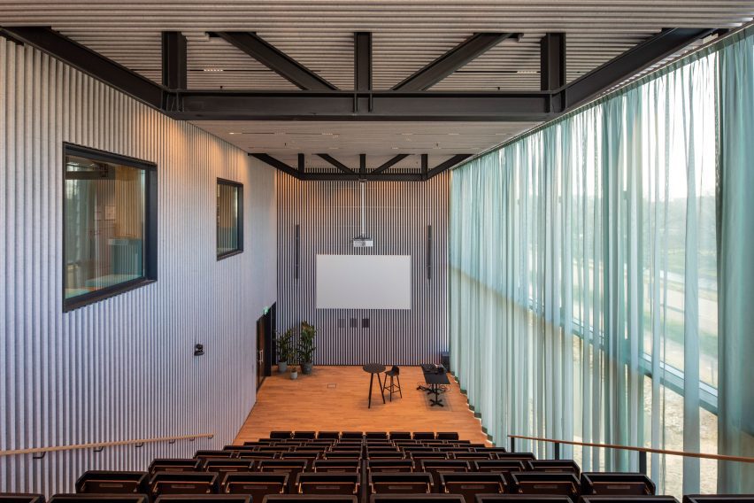 Auditorium with grey internal walls and glazed external wall at the Matrix One building