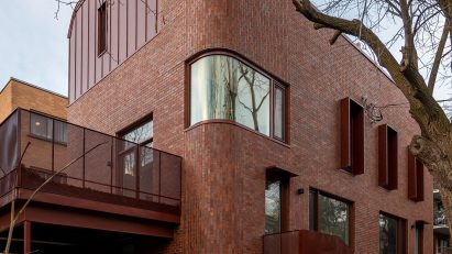 Red brick Montreal duplex with curved edges and windows