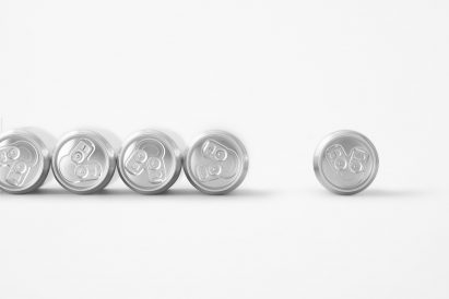 Silvery beer cans lined up in a row