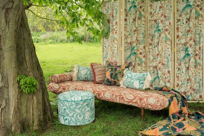 Chaise lounge, stool and curtain upholstered in ornate fabrics