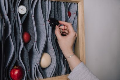 Hand placing keys in felt board