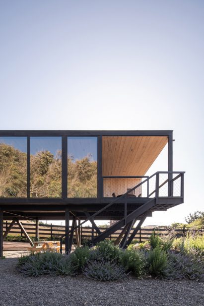 Home on stilts with glass windows