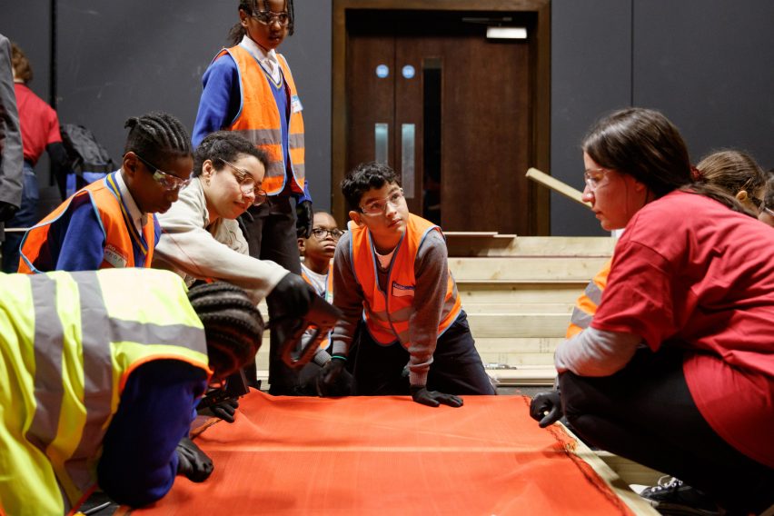 Children assembling timber stages for the Let's Build Brixton House theatre project