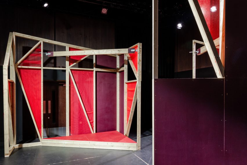 Triangular stages with timber frames and red netting built by school children and Matt+Fiona