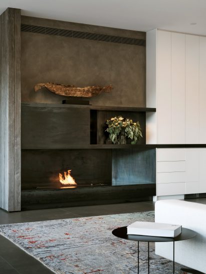 Fireplace with log sculpture