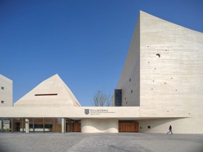 White-concrete sports centre in China
