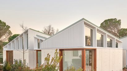 A cluster of mono-pitched square structures comprising House 016 by Arquitecturia