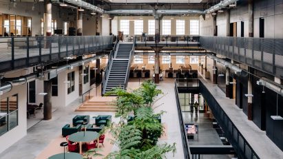 Interior atrium space with large skylight and open-plan co-working space
