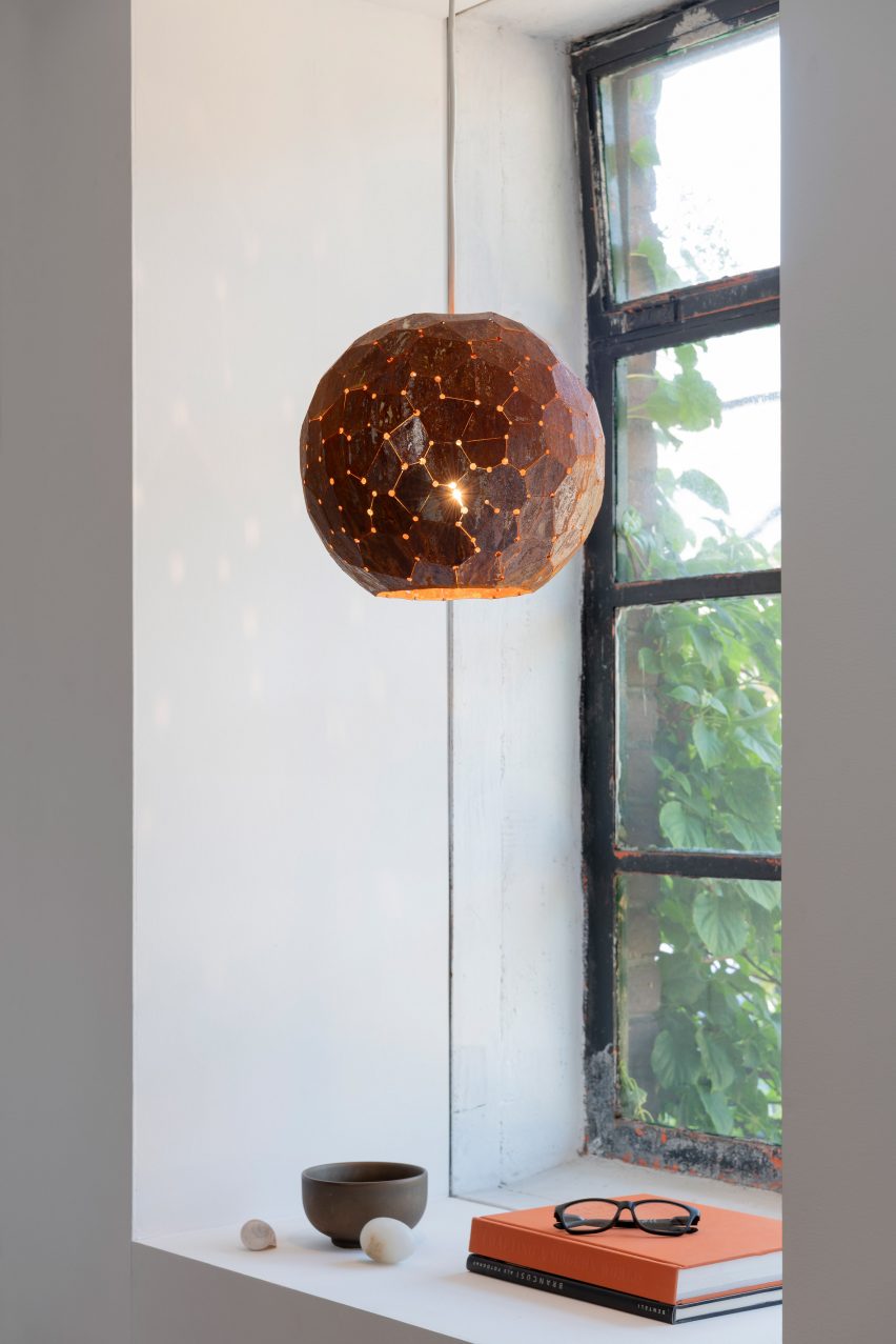 Bronze-coloured lamp shade in window