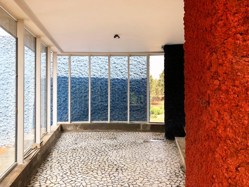 Interior space with stone walls and floors and rectangular windows
