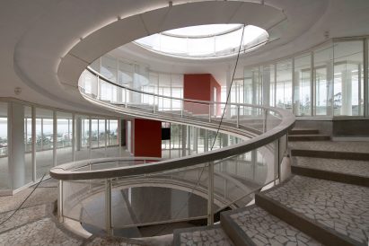 Internal spiral staircase with a circular opening in the roof