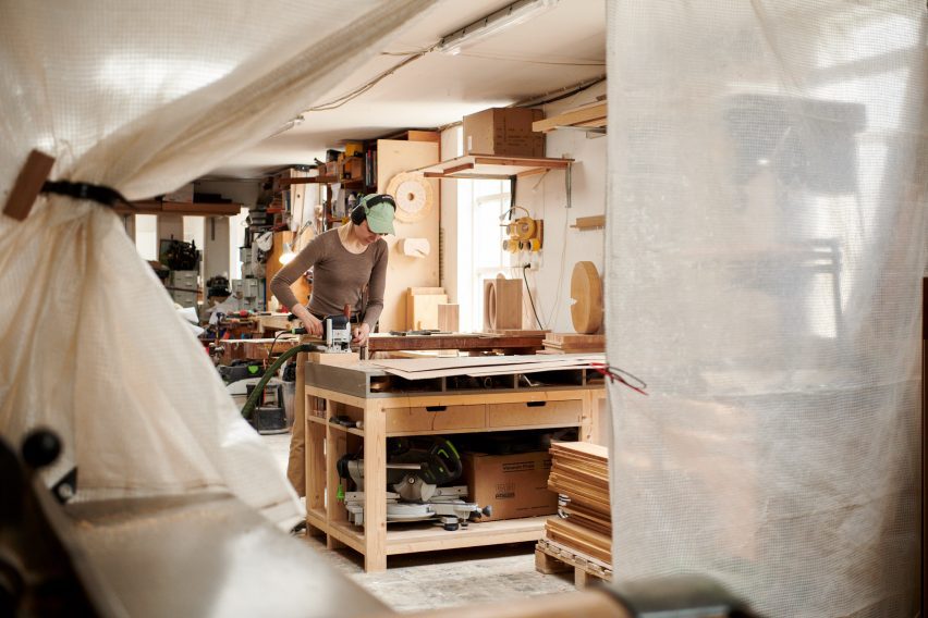 Designer working on wood for Three exhibition