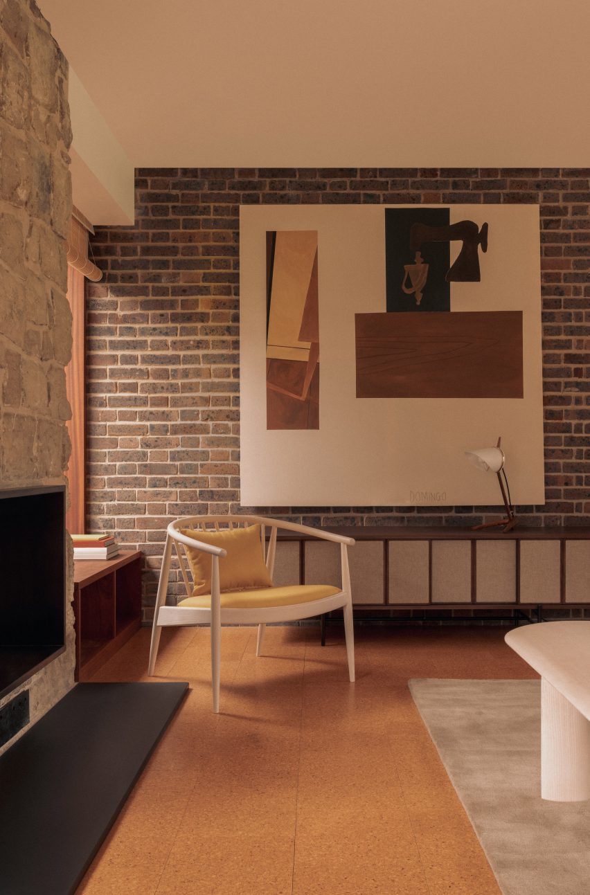 Yellow-upholstered chair in mid-century living space