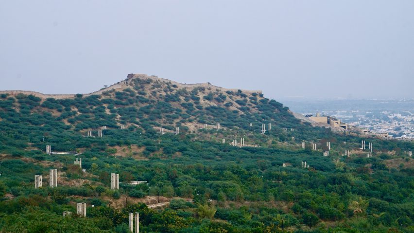 A hilltop with a fort wall and the Smritivan Earthquake Memorial and Museum