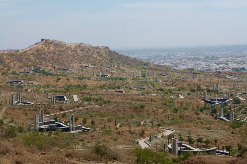 A hilly landscape with a fort wall meandering through