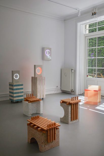 Photo of chairs and neon lights at the Kinship exhibition