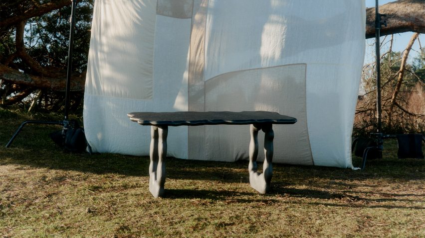 Photo of a black aluminium table by Ferm Living and Anna Maria Øfstedal Eng in front of a sheet