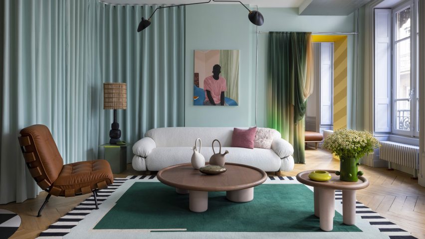 Home interior featuring cream sofa and brown chair