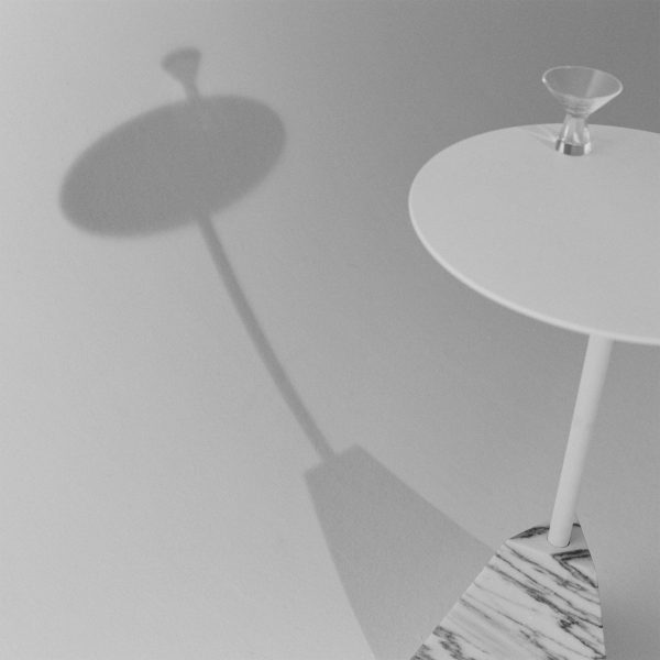 Black and white photo of a table and glass