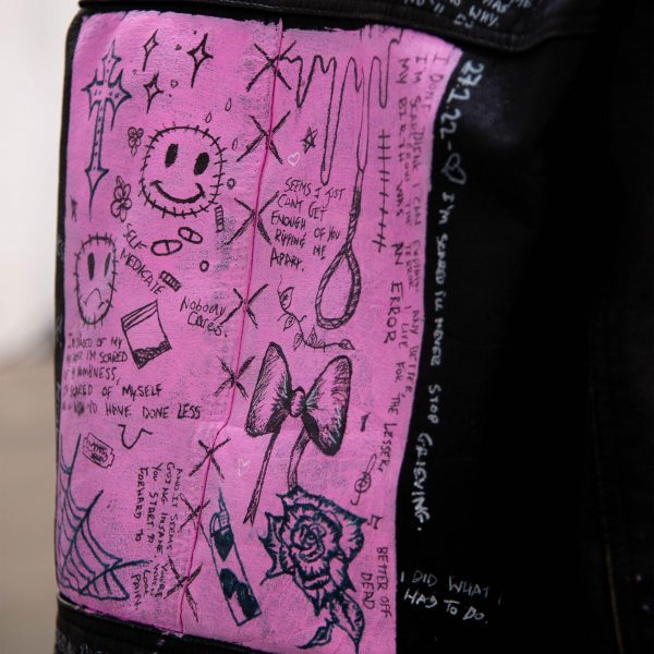 Photo of a pink patch on a denim jacket