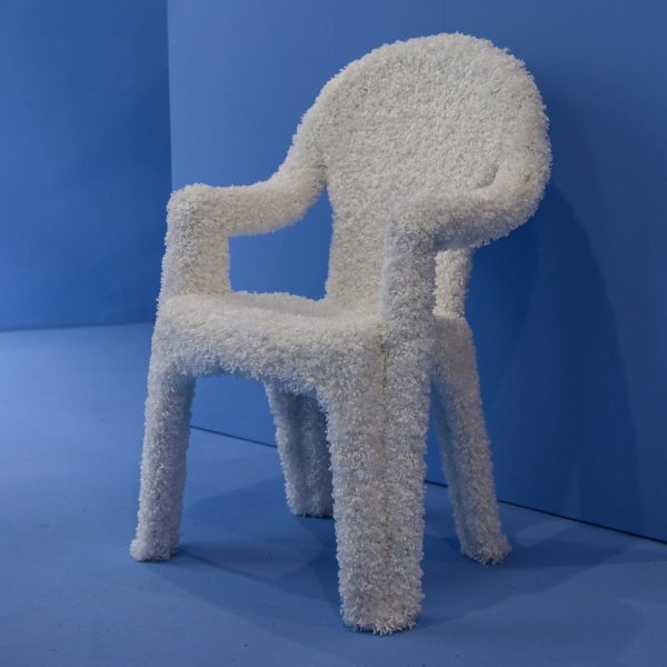 Photo of a white fluffy chair in a blue room