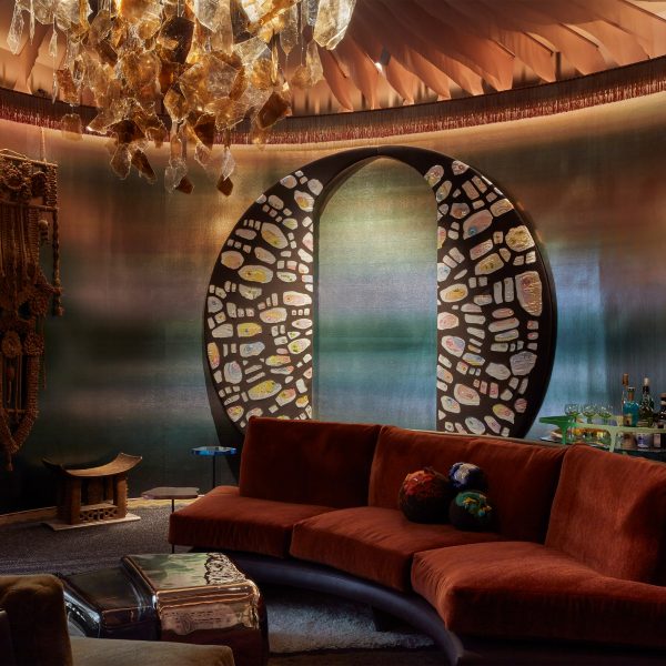 Photo of a sofa, light shade and wallhanging