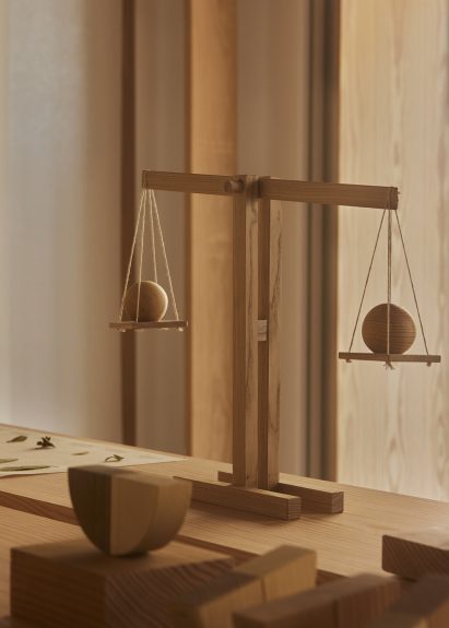 Photo of a wooden scale at Weight of Wood exhibition